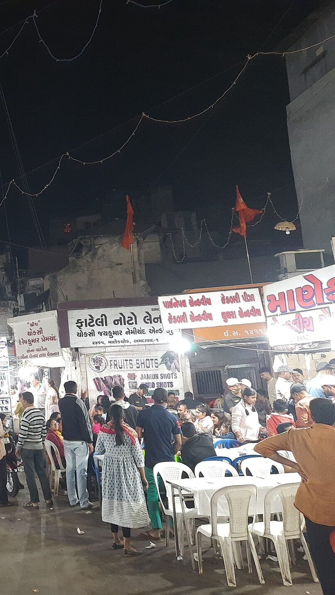 Food stalls and seating at Manek Chowk after dark, Ahmedabad